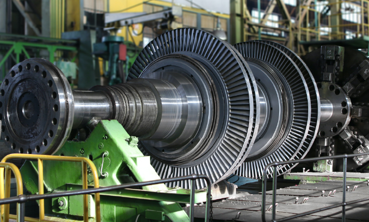 A large gearbox for industrial use is in a warehouse.