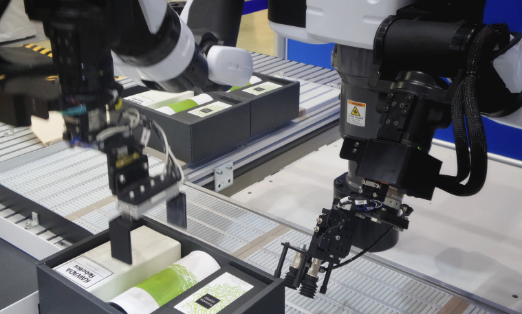 Robot being technology used on a manufacturing line.